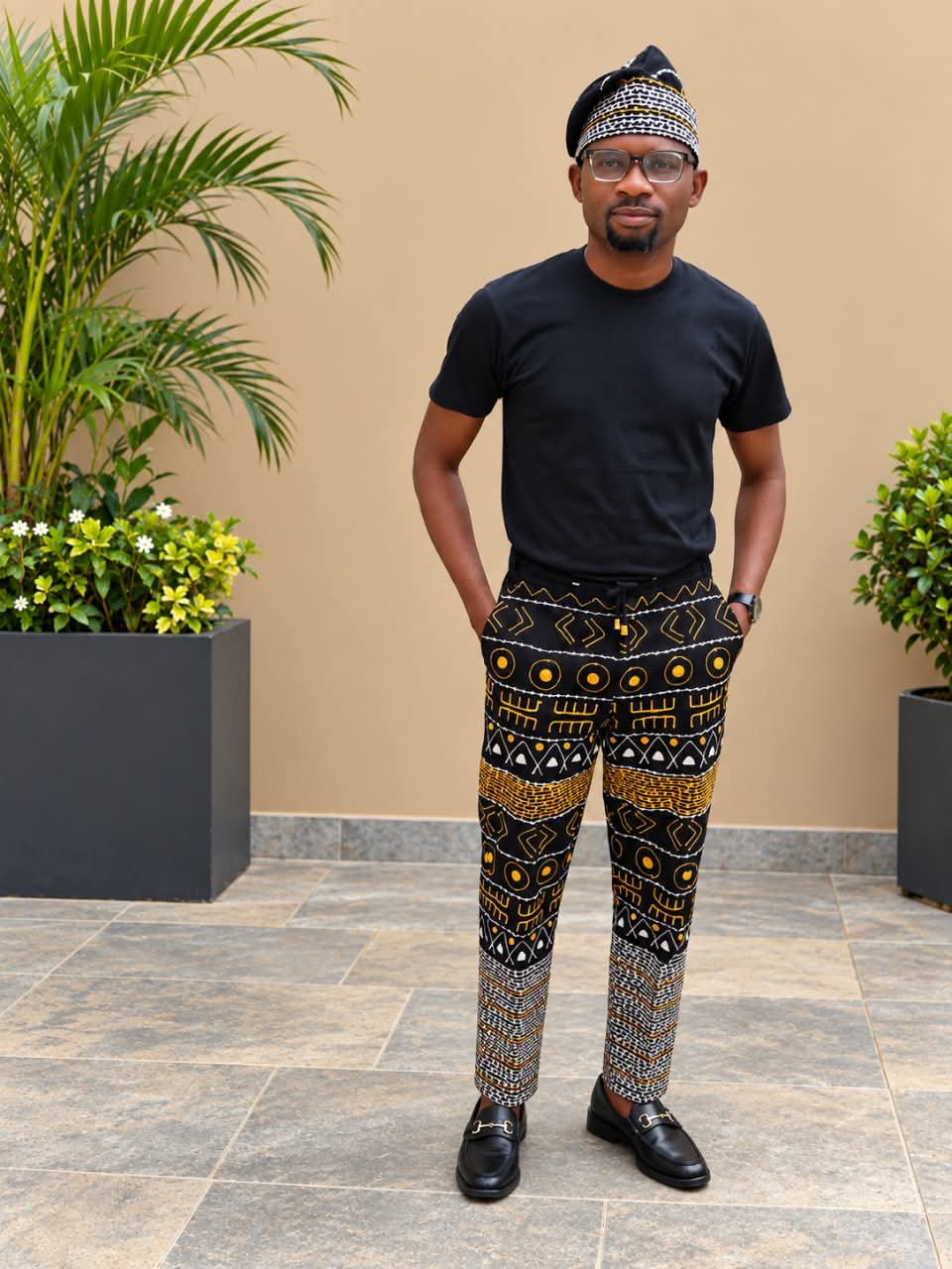 An embroidered menswear look shown on the Gee Royale founder page