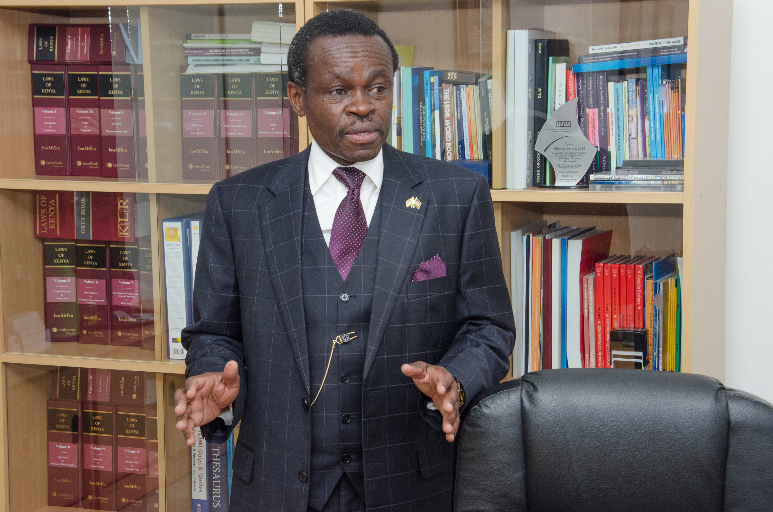 PLO Lumumba in his library